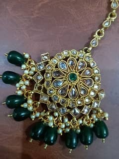 beautiful golden with green stones bindia 0