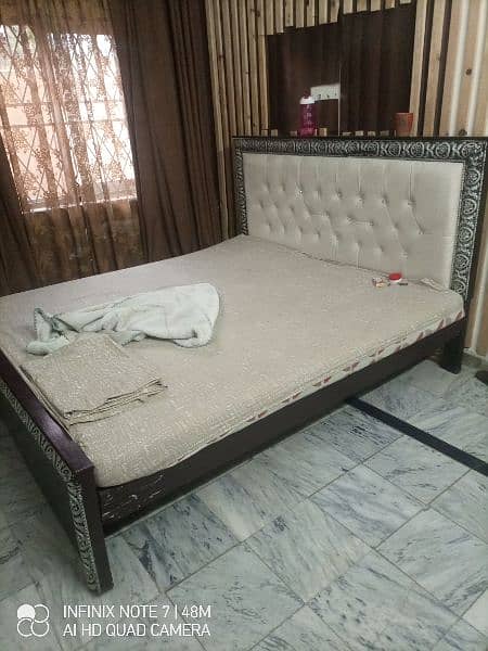 Wooden bed paded back 1
