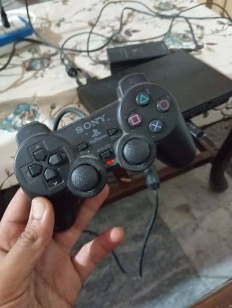 ps2 with 15 gamed excellent condition 1