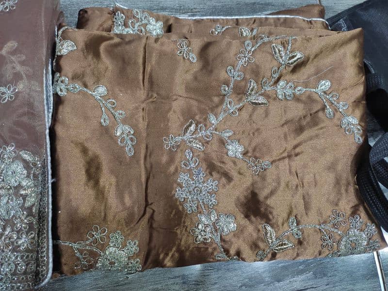 URGENT SALE. . . Brown Embroidered organza net Saree one time use only 17
