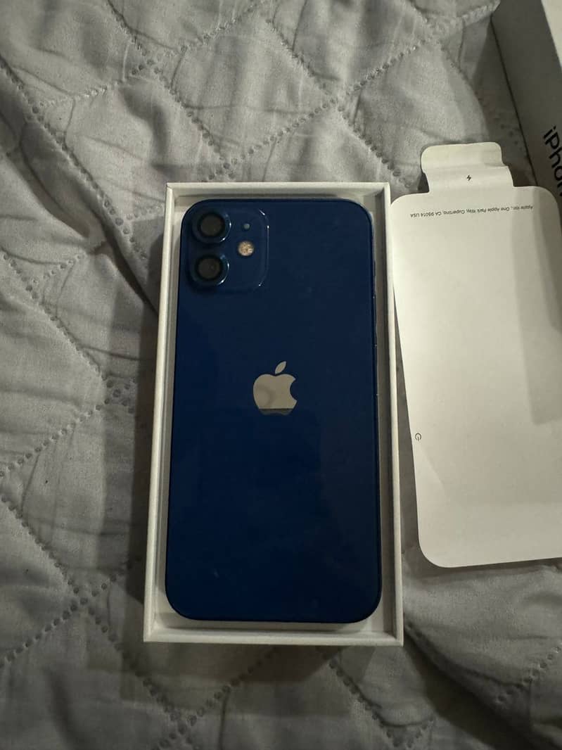 iphone 12 mini  blue 256 gb 10/10 bettery health 83  water pack 3