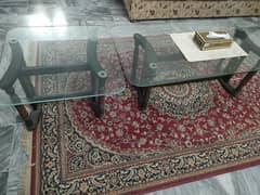 A set of three top glass tables.