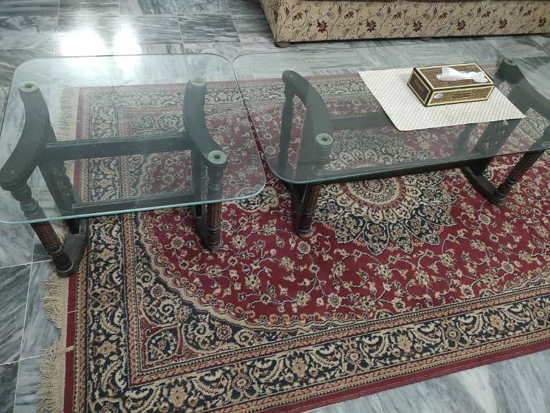 A set of three top glass tables. 0