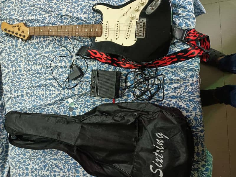 Electric guitar + pocket amplifier 2