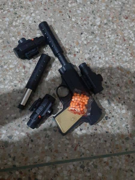 Sharla,Toy gun with scope and 1packet of sharla. . . 3
