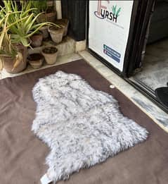 grey white fish rug