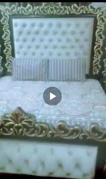 king bed with side table with attached long mirrors and one dressing 0