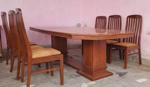 Wooden 6 seater dining table with 6 chairs.