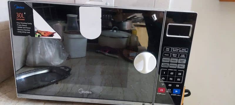 midea 30L grill microwave oven fro sale condition is perfect 0