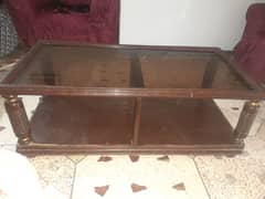Central table of wooden with glass top