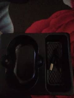 earbuds with charger and box
