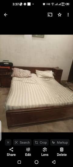 wooden bed with mattress and sidepieces