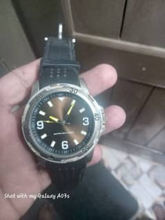 black dial watch with rubber strap