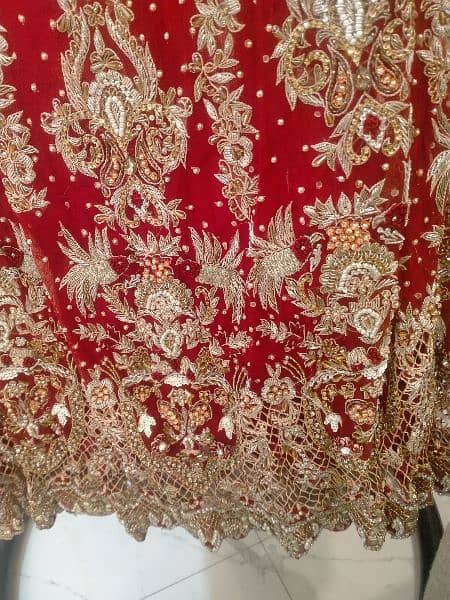 Red and goldn colors bridal lahnga very low price itny mn koi ni dy ga 1