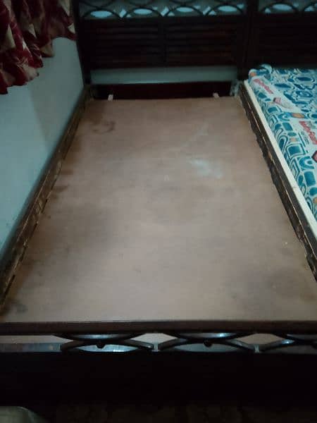 2 single Woden bed with original molty foam mattress,okay condition 2