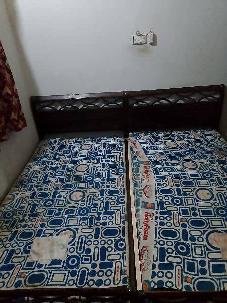 2 single Woden bed with original molty foam mattress,okay condition 3