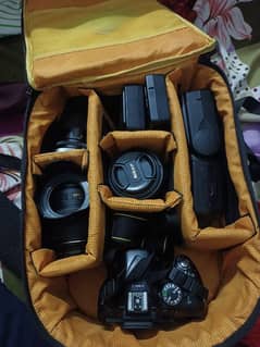 Nikon D5200 with 2 lens,2 batteries chargers & 2 bags