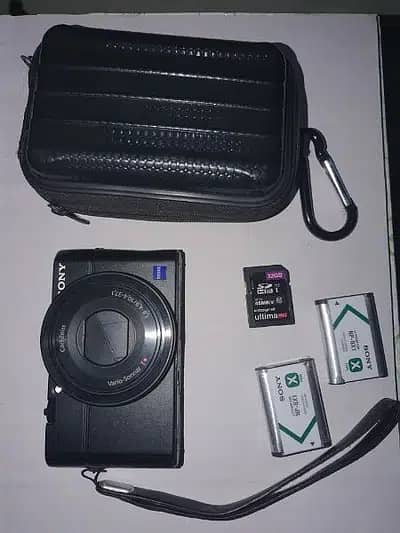 Sony rx100 Mark 2 with 2 batteries card and leather strip cover 1