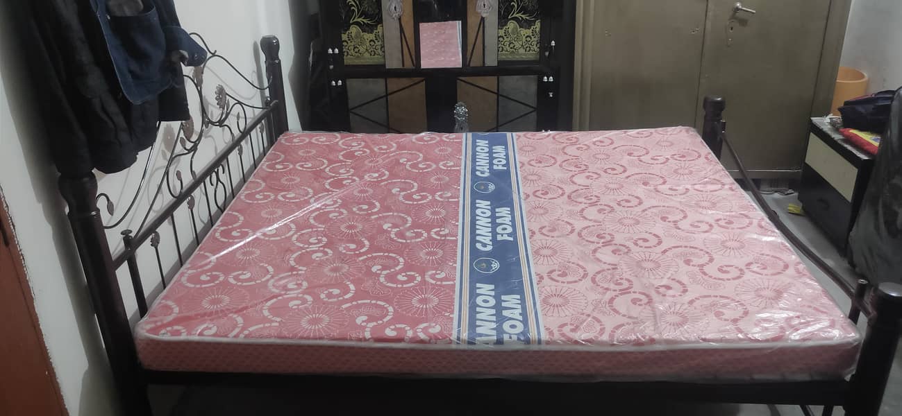 Iron bed with brand new mattress. 1