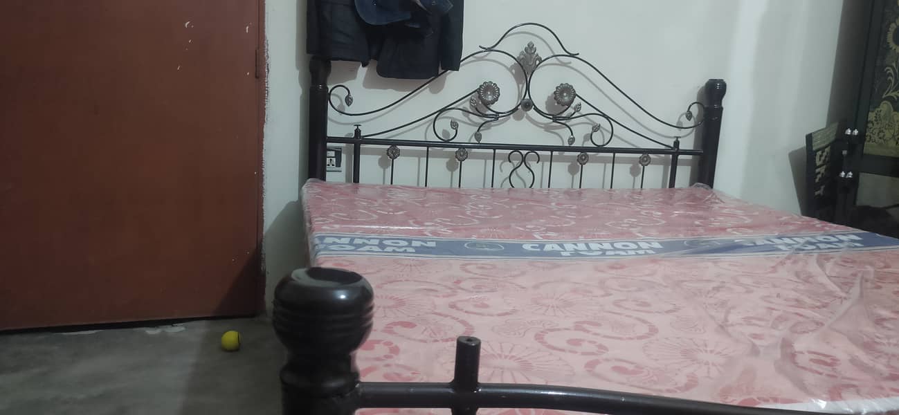 Iron bed with brand new mattress. 2
