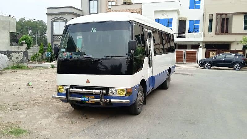 Mitsubishi Coaster Saloon staff van with business 1