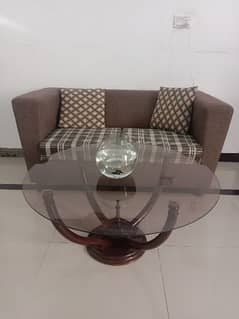 two seats sofa and round center table 0