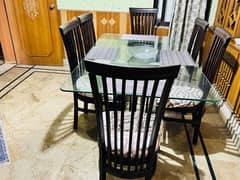 Dining table with glass top and six chairs plz contact 03231588939