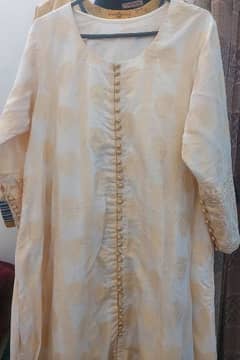 one pcs jacarad A line frock in off white colour with attached slip .