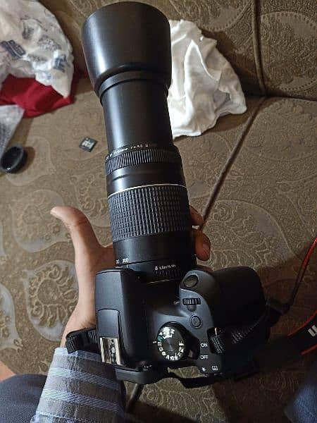 canon 1300D. camera.  2 lens 3