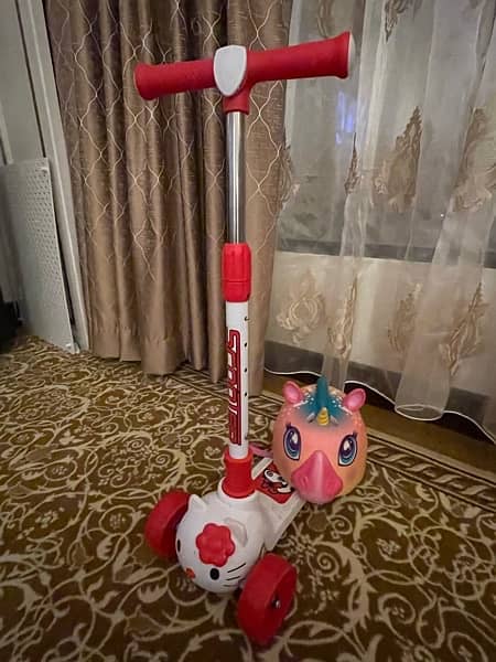 Slightly Used Scooty with Unicorn Helmet for Sale 2
