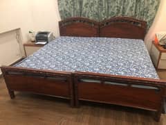 pair of single beds with mattresses solid wood