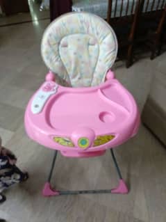 baby high chair with music. for sale