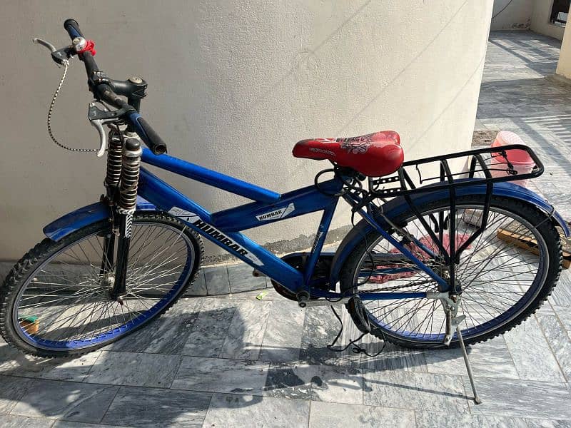 A XL size bicycle in  sports blue colour. . 1