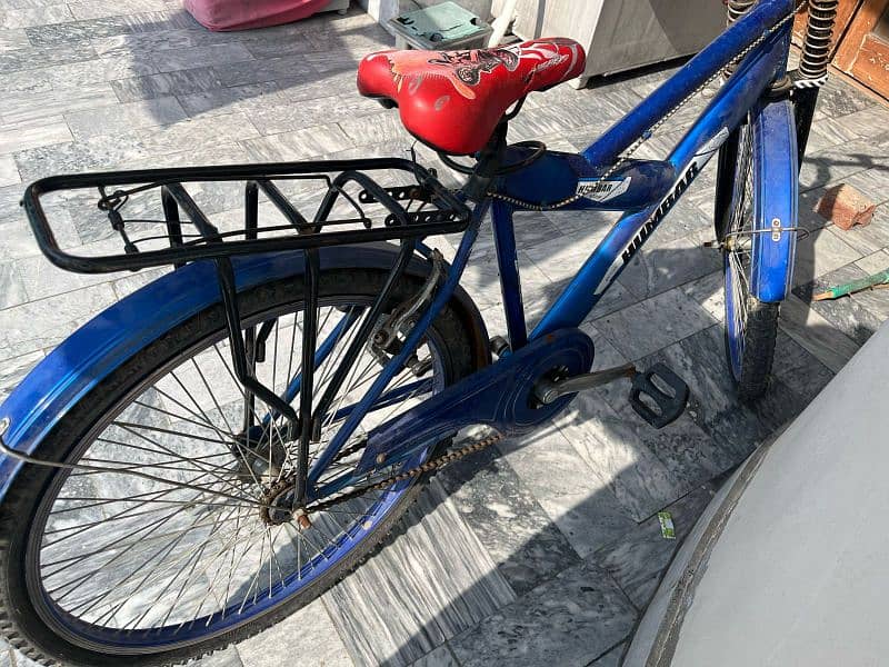 A XL size bicycle in  sports blue colour. . 4