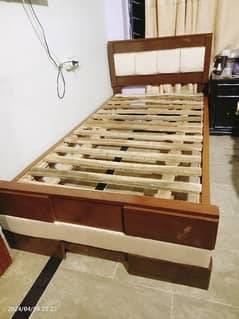 2 wooden single beds with poshish