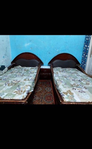 lasani and sheesham wood 2 single beds with writing  table 1