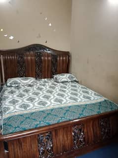 king size beautiful bed with side table
