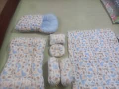 baby set with blanket and bister and pillows