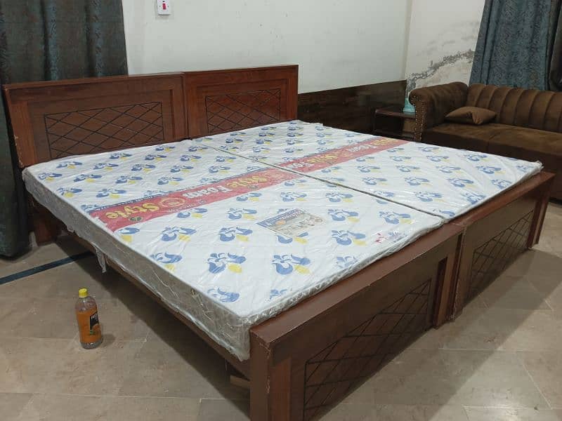 2 single beds with 2 new medicated  mattress 2