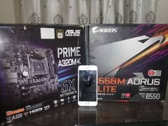 B550m Aorus Elite and A320 Asus Prime Motherboards with boxes