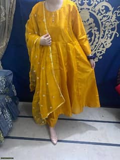 A beautiful yellow unstitched suit for womens