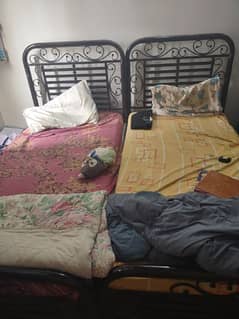 2 Single beds with mattresses
