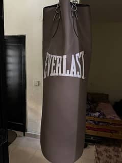 punching bag filled with wood scraps and hand wraps