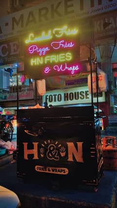 Black Stall with Colorful Neon lights and banner ( Urgent sale)