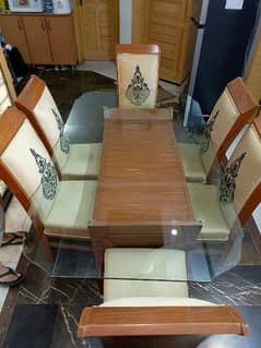 Glass top dining table with 6 chairs.