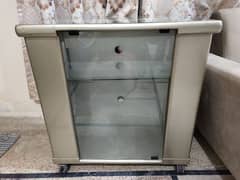 TV trolley with glass shelves for storage
