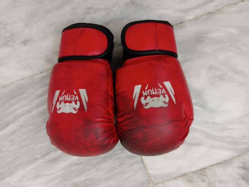 Venum 12 OZ Medium black shade red boxing gloves and defender 2