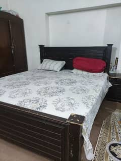 Queen size double bed with side tables. .