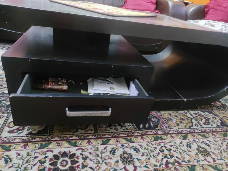 Center table dark brown colour . 2 drawer hn 0