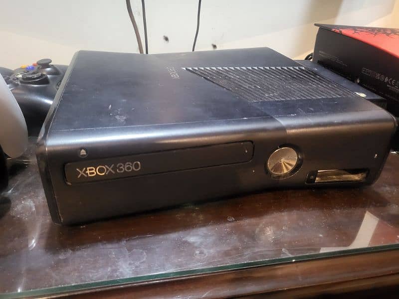 Xbox 360 J-Taged with 2 remote controllers. condition 8/10 3